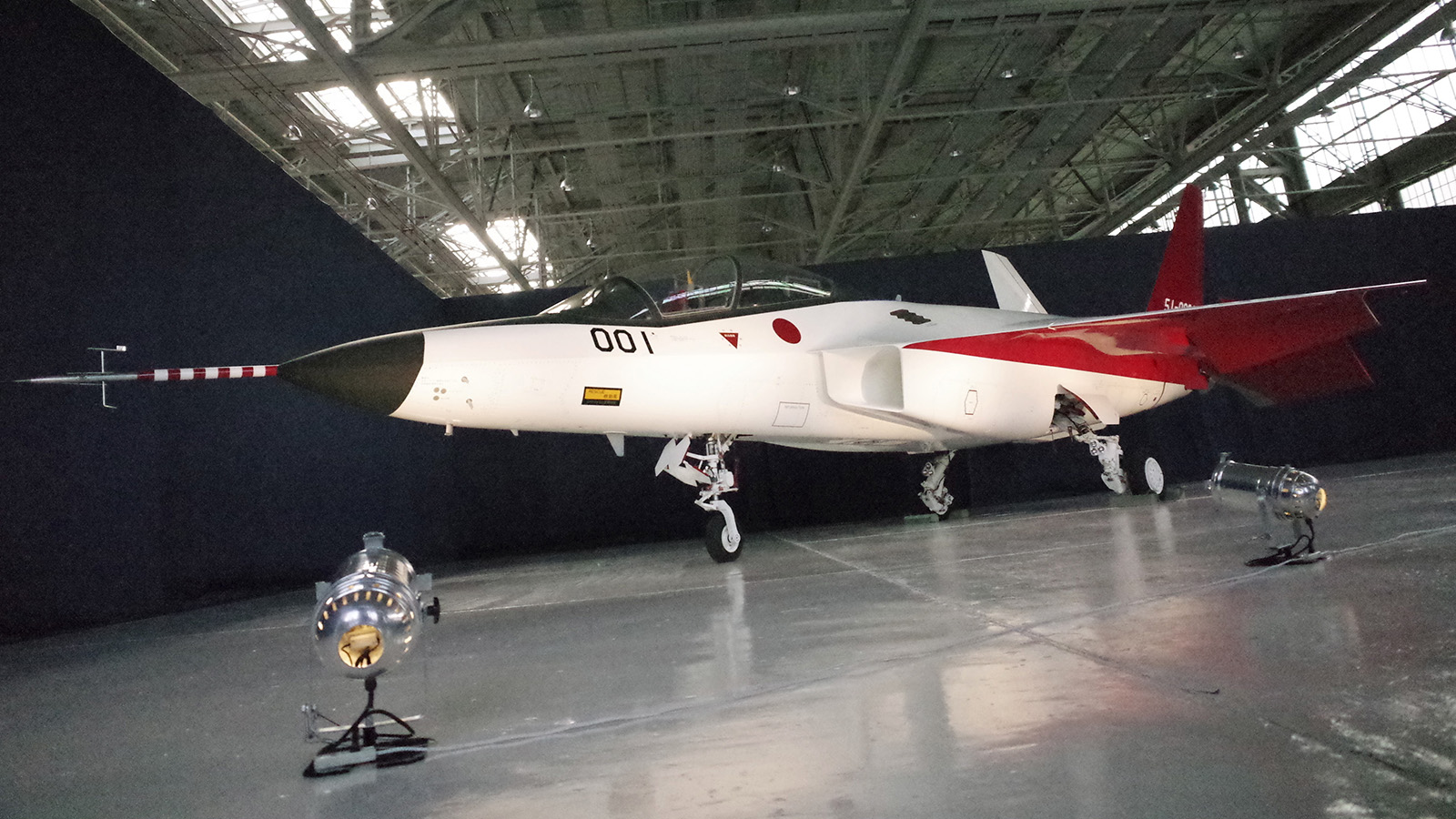 The first domestically-made stealth aircraft, X-2, sits in a hangar at Nagoya Airport in Toyoyama town, central Japan, Thursday, Jan. 28, 2016. The demonstration plane is expected to make its maiden flight sometime after mid-February. A Defense Ministry official said the technology will give Japan the option of developing its own stealth fighter jets in the future. (AP Photo/Emily Wang)